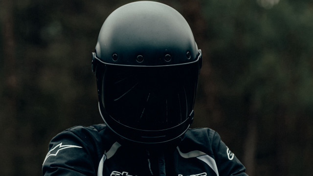 Helmet motorcycle forest portrait blurry free wallpaper for desktop - medium preview image