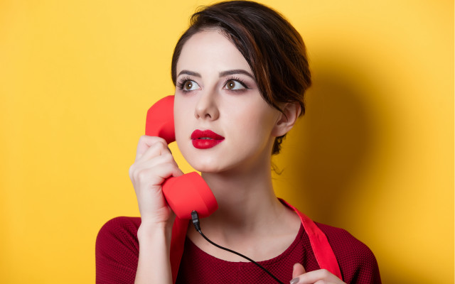 Surprised woman red phone portrait free wallpaper for desktop - medium preview image