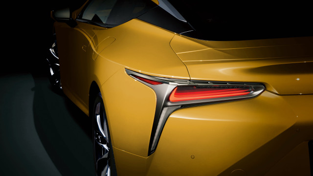 Yellow sports car closeup dark free wallpaper for desktop - medium preview image