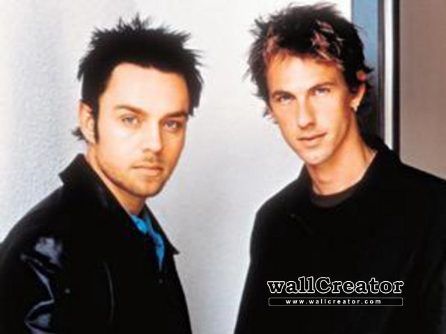 Two men standing room wall #2 free wallpaper for desktop - medium preview image