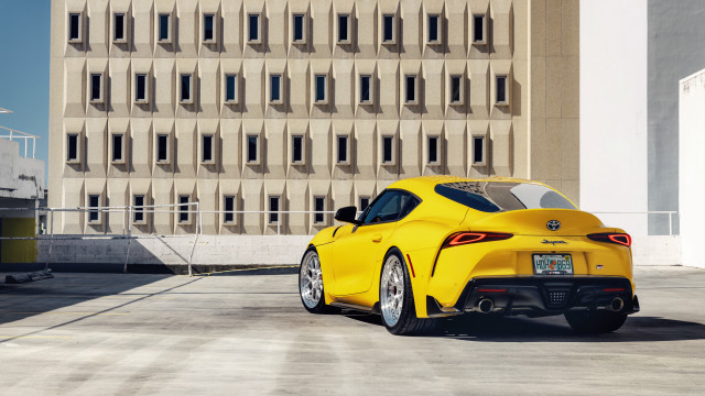 Yellow sports car building windowed free wallpaper for desktop - medium preview image