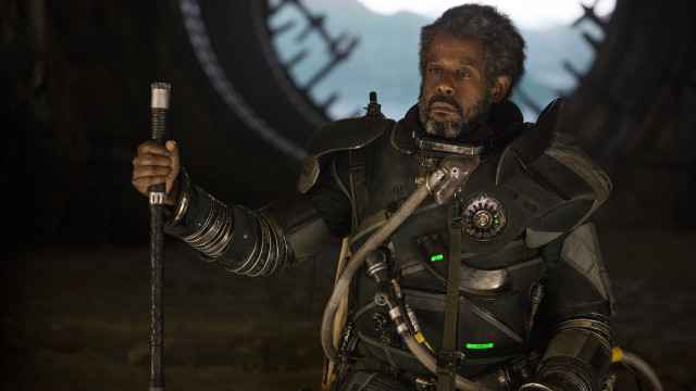 Man black suit holding sword free wallpaper for desktop - medium preview image