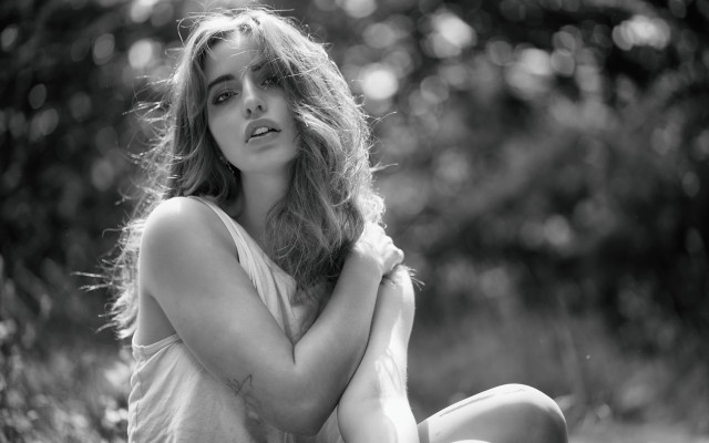 Woman sitting crossed arms bokeh free wallpaper for desktop - medium preview image