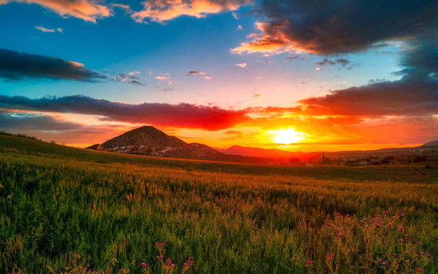 Sunset field mountain clouds horizon free wallpaper for desktop - medium preview image