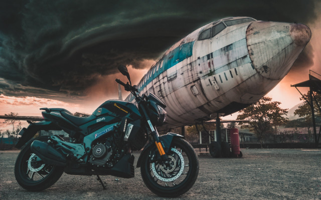 Motorcycle airplane stormcloud city matte free wallpaper for desktop - medium preview image