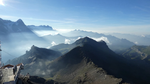 Mountain range clouds buildings people free wallpaper for desktop - medium preview image