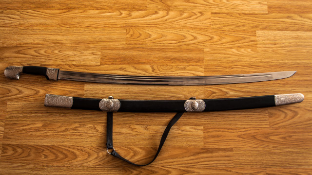 Sword blackleather silverhandle woodenfloor blackstrap free wallpaper for desktop - medium preview image