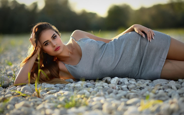 Woman rock ground crossed posing free wallpaper for desktop - medium preview image