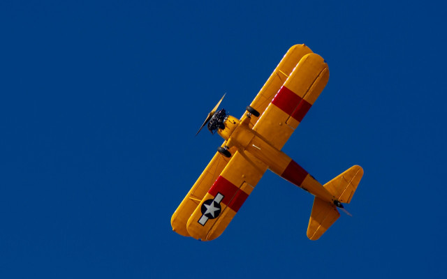 Yellow airplane blue sky propellers free wallpaper for desktop - medium preview image
