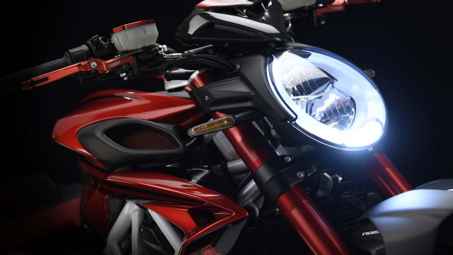 Motorcycle closeup headlight black background free wallpaper for desktop - medium preview image
