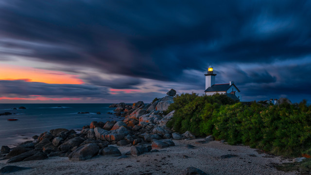 Lighthouse rocky shore sunset mystical free wallpaper for desktop - medium preview image