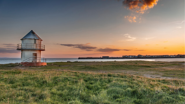 Lighthouse grassy field ocean sunset free wallpaper for desktop - medium preview image