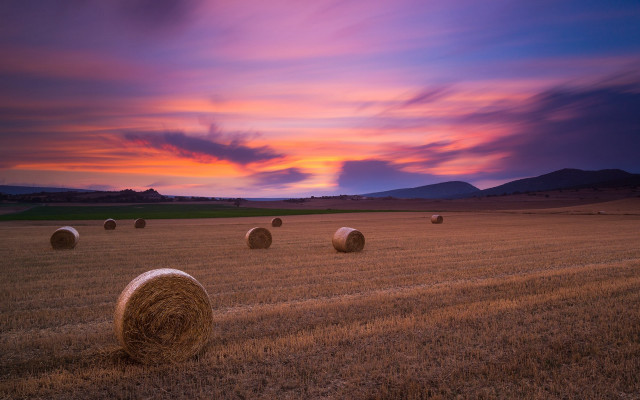 Sunset hayfield colorful sky clouds free wallpaper for desktop - medium preview image