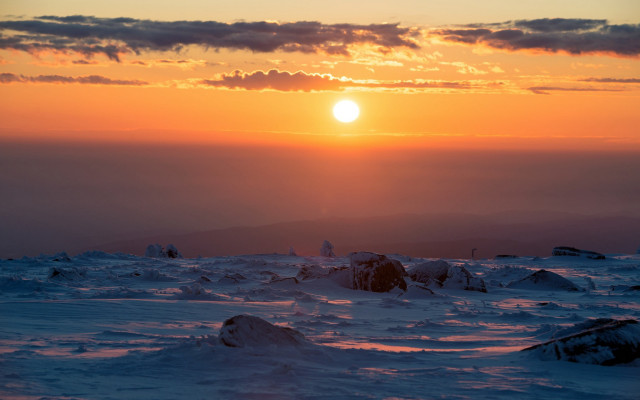 Sunset snowy mountain skier distant free wallpaper for desktop - medium preview image