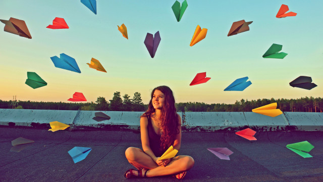 Woman sitting colorful umbrellas surreal free wallpaper for desktop - medium preview image