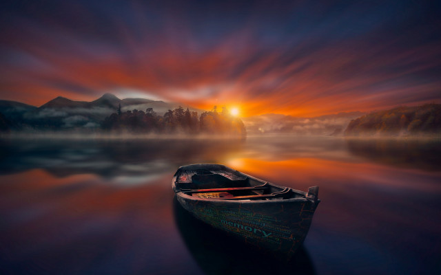 Boat water mountain sunset mystical free wallpaper for desktop - medium preview image