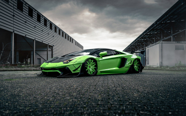 Green sports car cloudy building free wallpaper for desktop - medium preview image