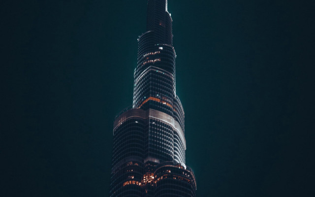 Tall building lit night sky free wallpaper for desktop - medium preview image