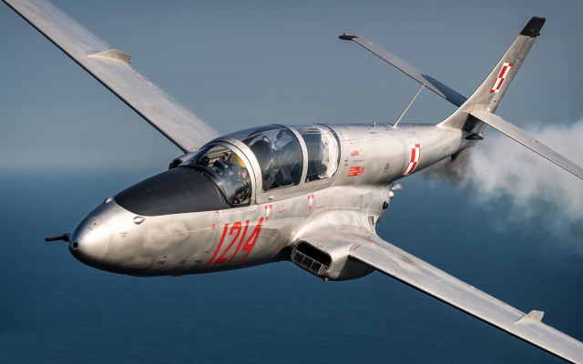 Silver airplane ocean smoke red free wallpaper for desktop - medium preview image