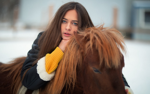 Woman holding horse tail serious free wallpaper for desktop - medium preview image