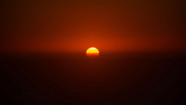 Sunset orange sun black background free wallpaper for desktop - medium preview image