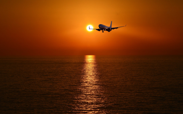 Plane ocean sunset sky sun free wallpaper for desktop - medium preview image