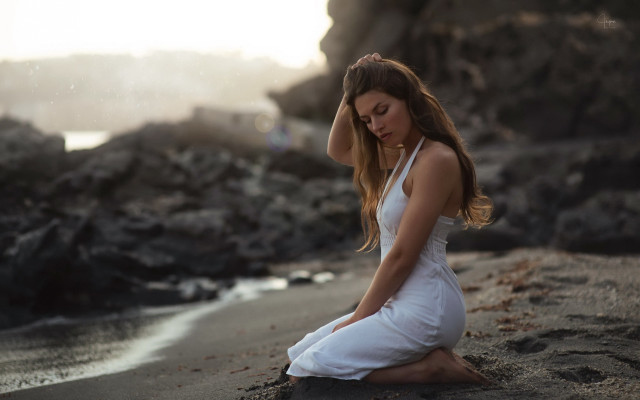 Woman beach sitting blurry realistic free wallpaper for desktop - medium preview image