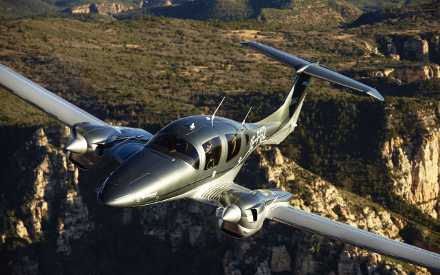 Small airplane mountain range valley free wallpaper for desktop - medium preview image