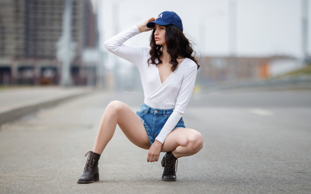 Woman kneeling road hat boots free wallpaper for desktop - medium preview image