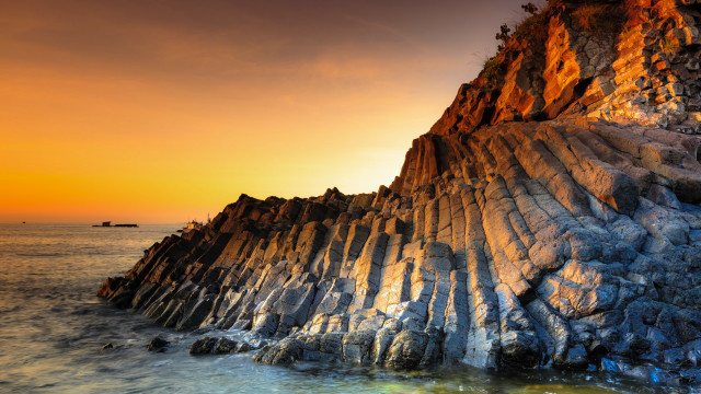 Rock formation ocean boat sunset free wallpaper for desktop - medium preview image