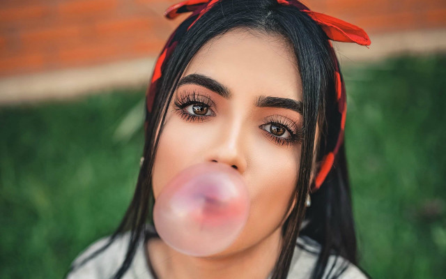 Woman blowing bubble red bow free wallpaper for desktop - medium preview image