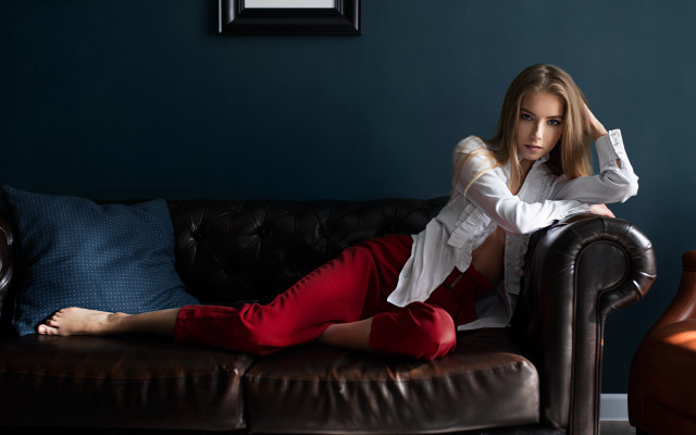 Woman sitting couch blue wall #2 free wallpaper for desktop - medium preview image