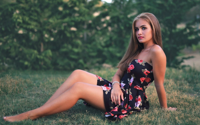 Woman floral dress sitting outdoors free wallpaper for desktop - medium preview image