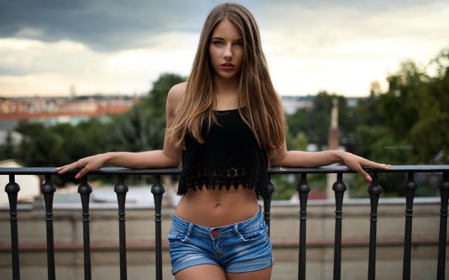 Woman balcony city blurry model free wallpaper for desktop - medium preview image