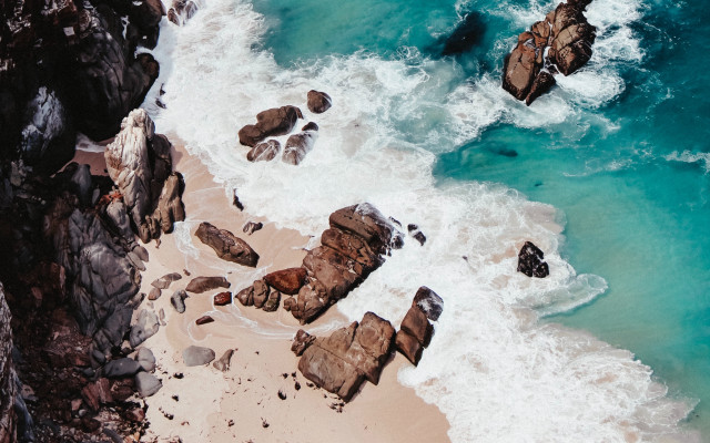 Beach rock formation water shore free wallpaper for desktop - medium preview image