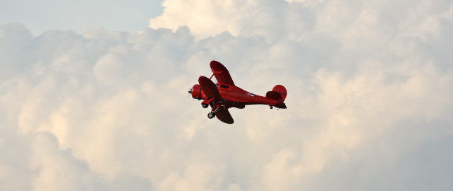 Red plane blue sky clouds free wallpaper for desktop - medium preview image