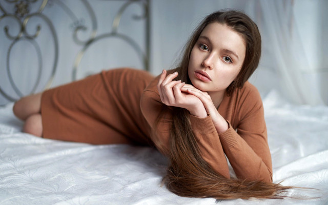 Woman laying bed serious arabesque free wallpaper for desktop - medium preview image