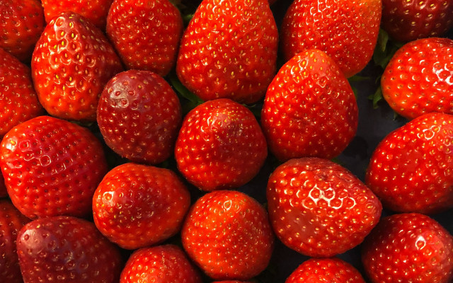 Red strawberries pile table black free wallpaper for desktop - medium preview image