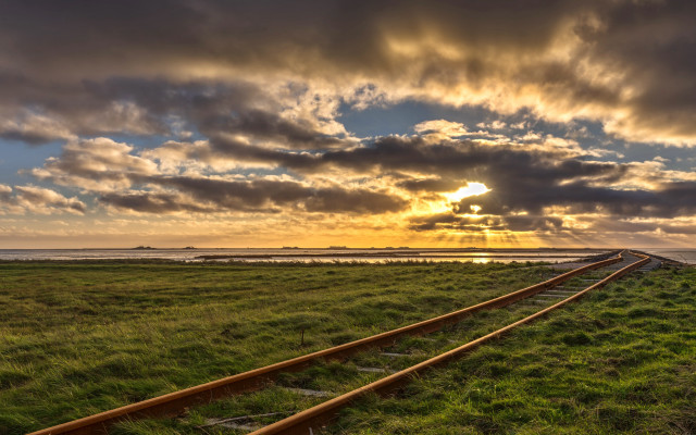 Train track grassy field sunset free wallpaper for desktop - medium preview image