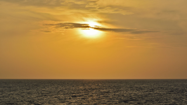 Boat sunset ocean clouds orange free wallpaper for desktop - medium preview image