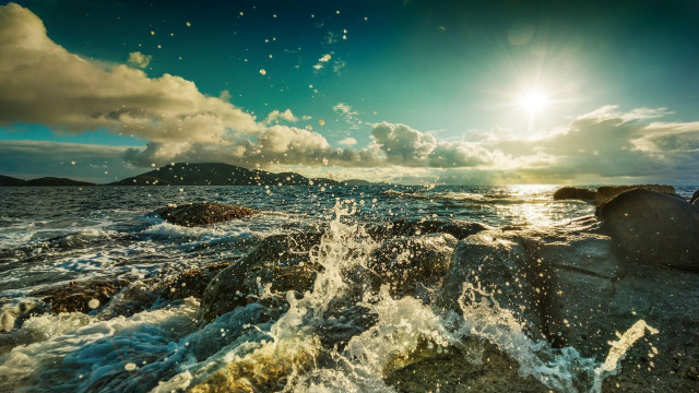 Sunlight ocean rocks waves beach free wallpaper for desktop - medium preview image