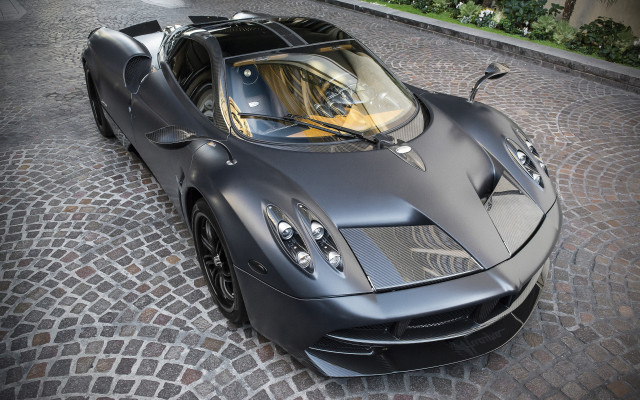 Black sports car cobblestone city free wallpaper for desktop - medium preview image