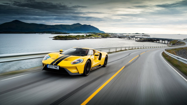 Yellow sports car ocean bridge free wallpaper for desktop - medium preview image