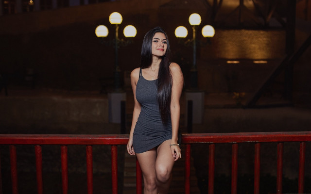 Woman balcony red railing night free wallpaper for desktop - medium preview image