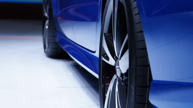 Car tire closeup white floor free wallpaper for desktop - medium preview image