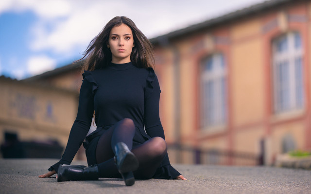 Woman black dress sitting outdoors free wallpaper for desktop - medium preview image