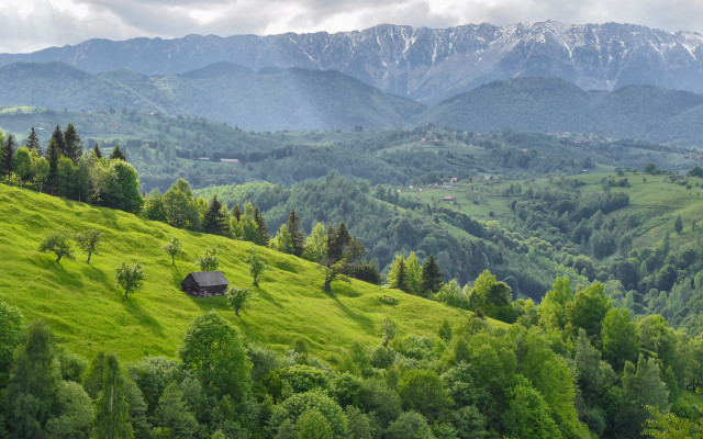 Green hillside cabin mountains clouds free wallpaper for desktop - medium preview image