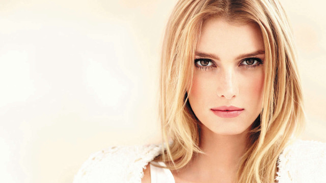 Blonde woman serious portrait hyperrealism free wallpaper for desktop - medium preview image