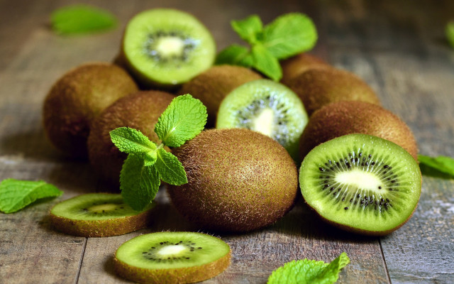 Kiwis leaves wooden table spoon free wallpaper for desktop - medium preview image