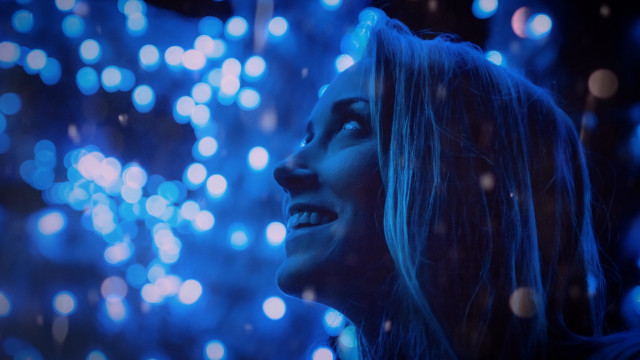 Woman smiling fireworks blue lights free wallpaper for desktop - medium preview image